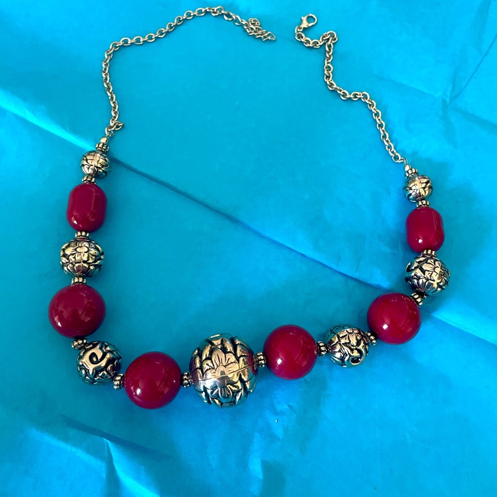 Red and silver colored necklace